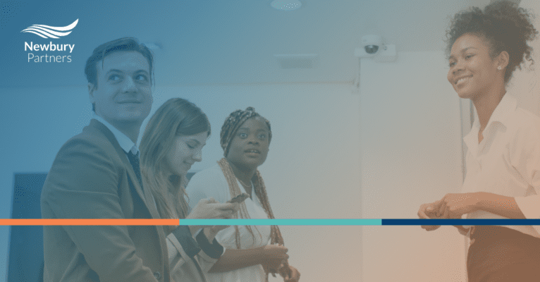 A team collaborating in a modern office setting, discussing IT staffing solutions and CRM optimization strategies.
