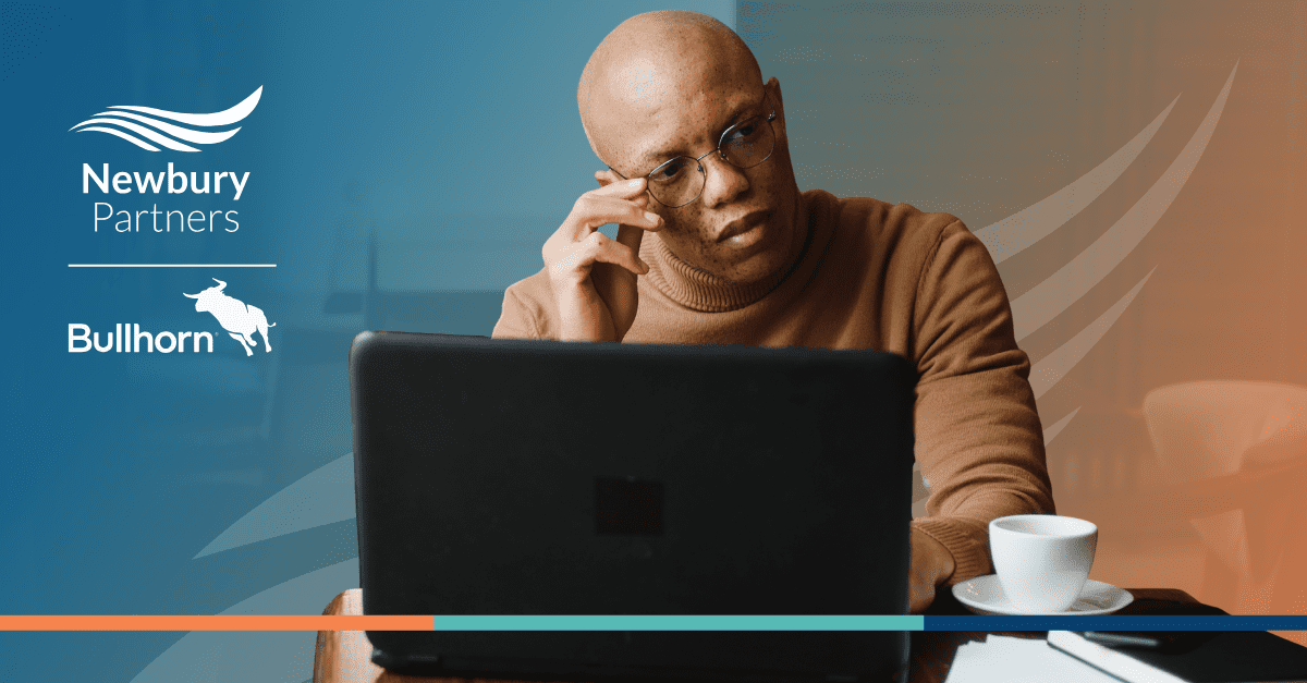 Staffing professional working on laptop reviewing Bullhorn ATS integration with open-source career portal solutions